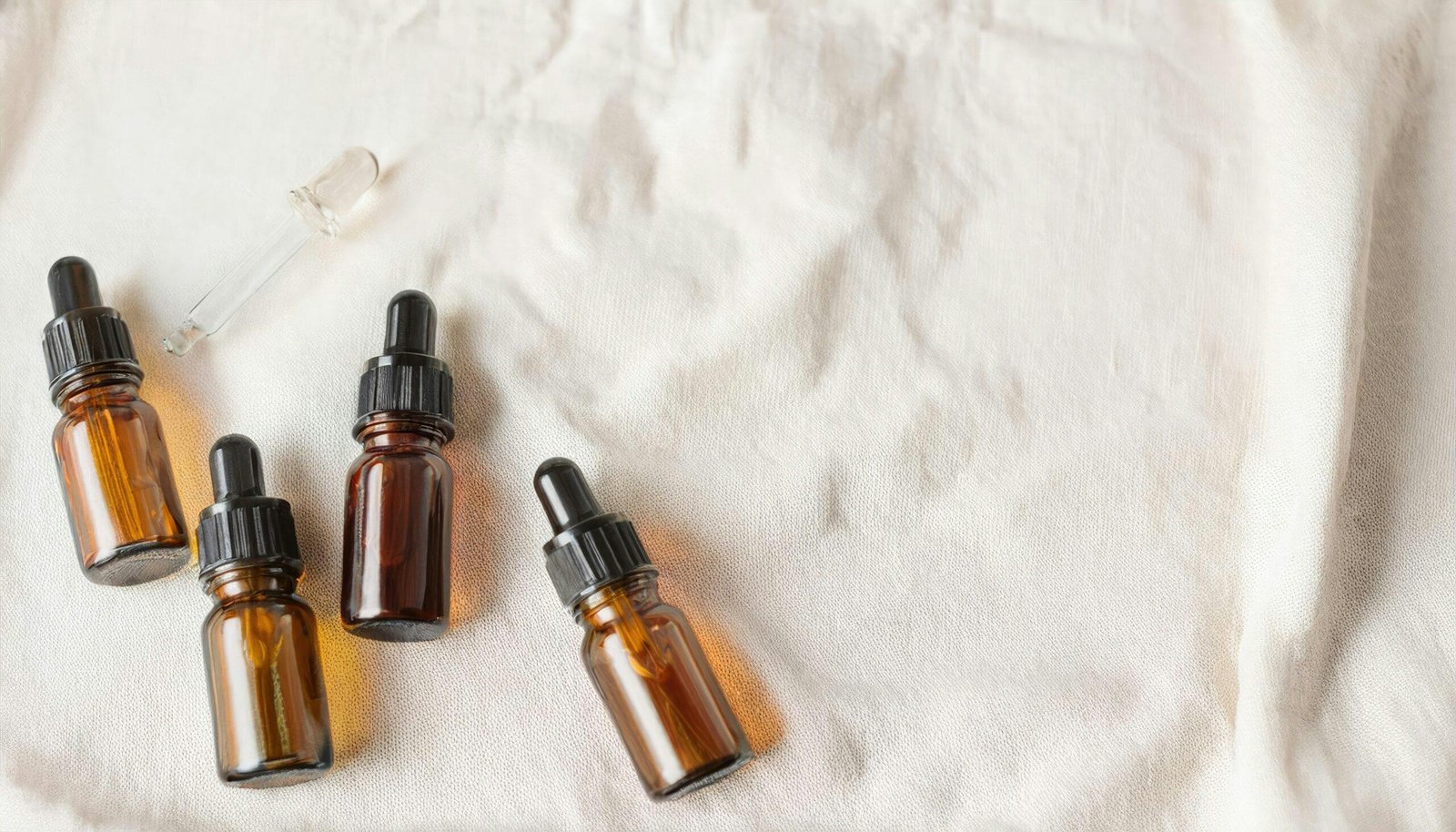 Woman applying hydrating oil to her face