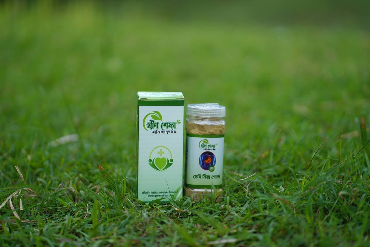 A dropper dispensing golden organic hemp oil onto fingertips