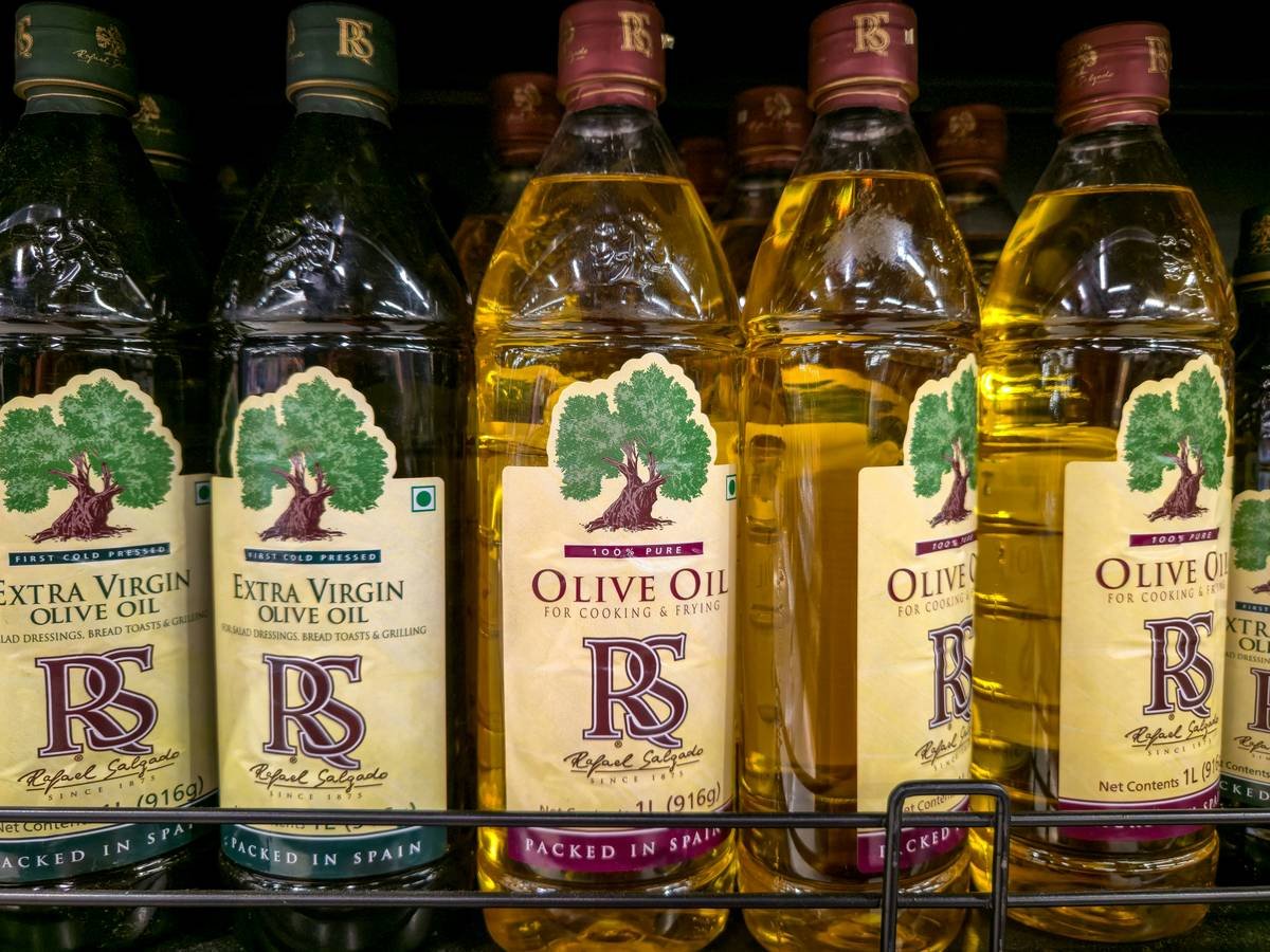 A side-by-side comparison showing texture differences between cold pressed and regular olive oil.