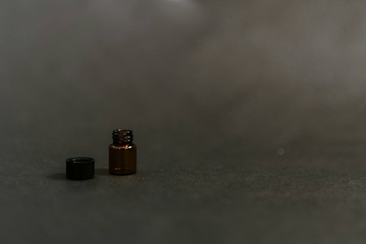 Close-up of a bottle showing certification logos such as USDA Organic and COSMOS-approved stamps.