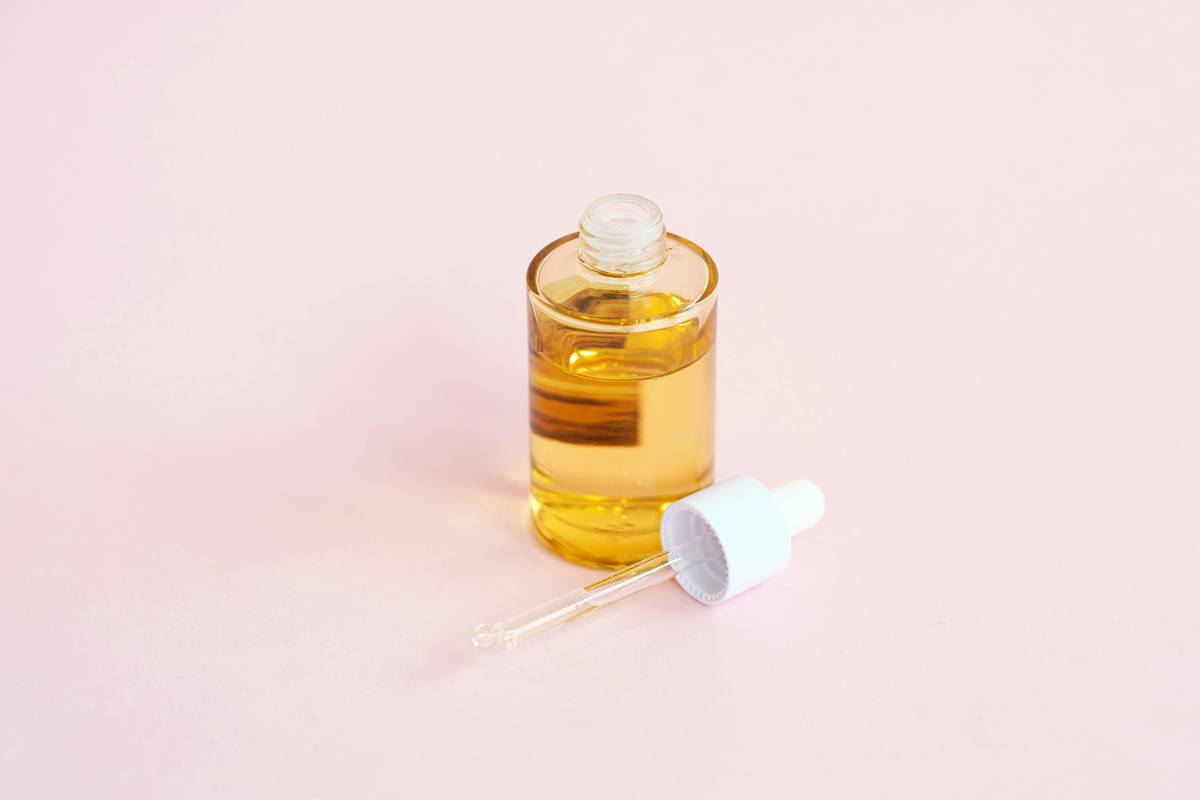 Freshly bottled skincare oil organic acne oily skin in amber glass dropper